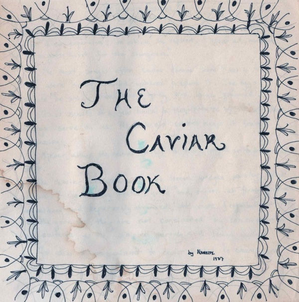 The cover of a small square booklet lettered by hand in blue ink, THE CAVIAR BOOK, inside a hand-drawn border, stained by water, signed at the foot: by Nanette 1977.