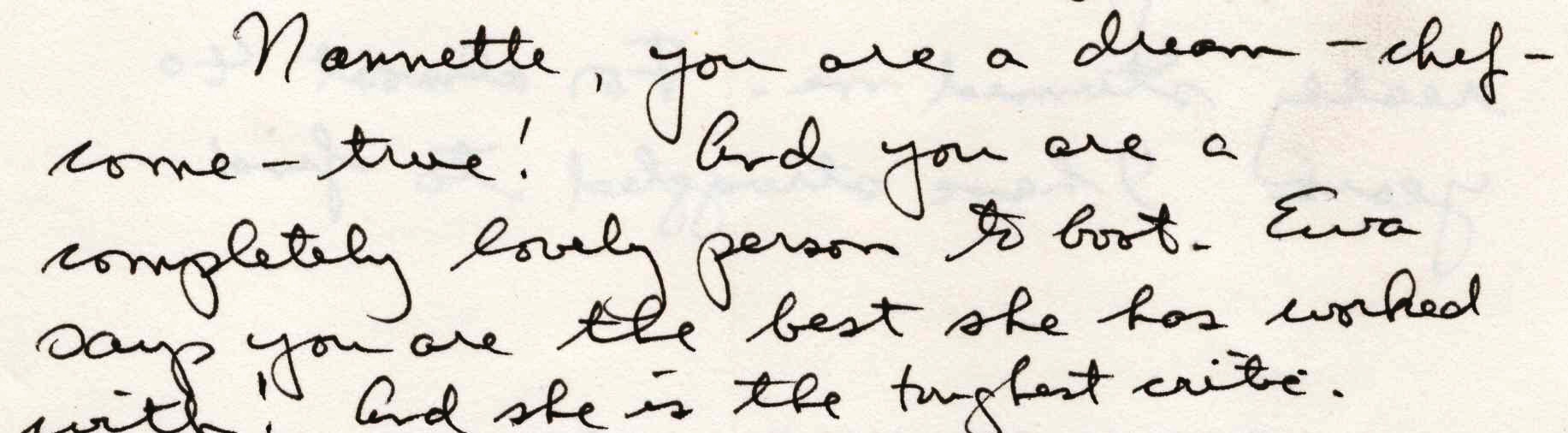Five lines of flowing black ink handwriting on cream paper.